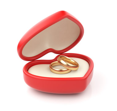 Gold wedding rings in valentine box 3D. Isolated on white backgr