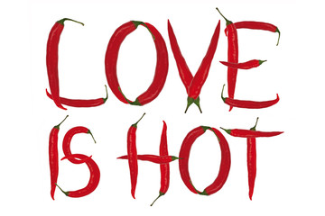 inscription love is hot maked from red chili peppers