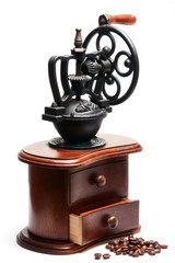 vintage coffee mill with beans and open compartment