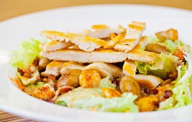 Chicken salad with grated carrots, mushrooms, bread croutons and