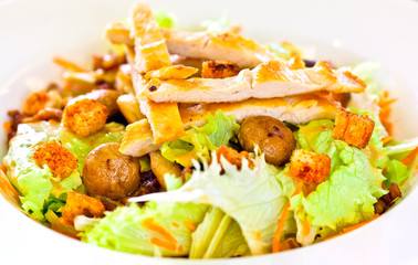 Chicken salad with grated carrots, mushrooms, bread croutons and