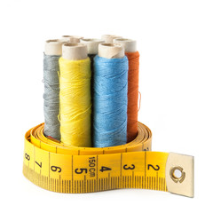 Sewing thread with measure tape isolated