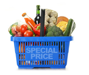 Shopping basket and groceries isolated on white