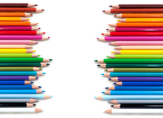 Fototapeta premium two groups of color pencils on white background