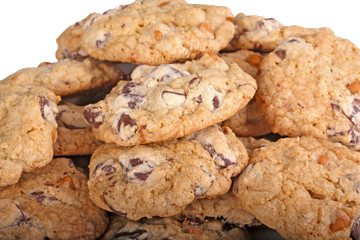 Mound of chocolate chip cookies against a white background