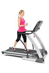 young woman doing exercises on treadmill