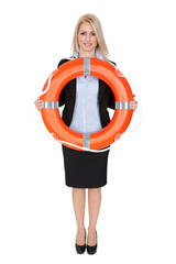 Beautiful businesswoman with life buoy