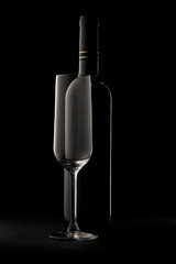 Bottle of wine and empty glass