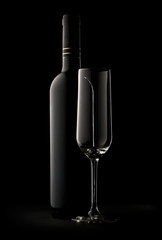 Bottle of wine and empty glass