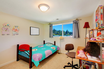 Girl kids bedroom with desk and bed.