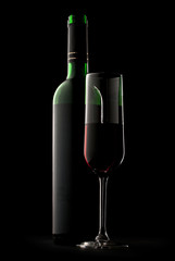 Bottle and glass of wine in black