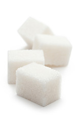 Cubes of sugar on the white background