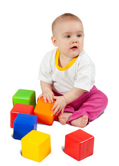 Baby  plays with toy blocks