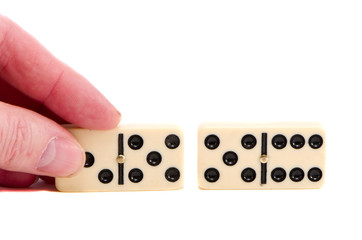 isolated two domino bone and fingers