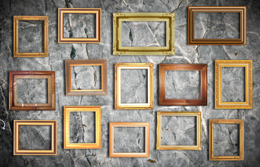 golden frame on old wall .