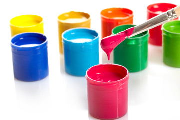 Paint buckets with paintbrush over white background