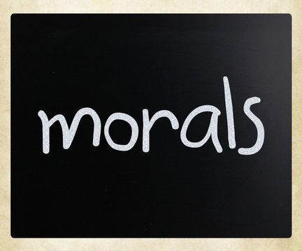 "Morals" handwritten with white chalk on a blackboard