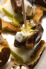 Appetizer Plate with Dactyl, Pecan nuts and Cheese