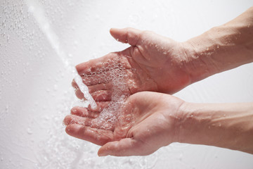 Hands and water.