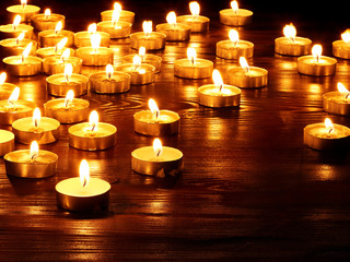 Group of  candles on  black background.