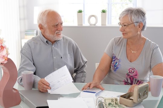 Senior couple discussing finances at home