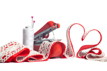Mini machine sew heart from red and white ribbons - obrazy, fototapety, plakaty