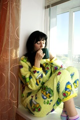 The woman with a cup of coffee