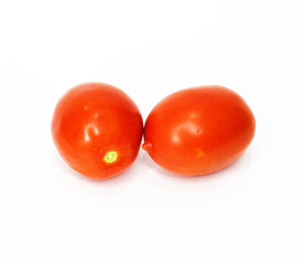 two tomatoes isolated on white