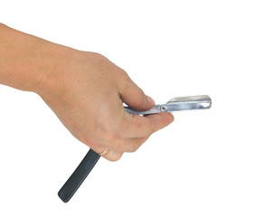 hand holding classic straight razor on white background