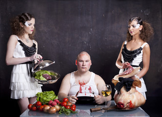 Young girls serving raw pig heart to a fat man - 38563421