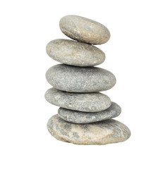 A stack of slightly off-balanced zen stones isolated on white ba