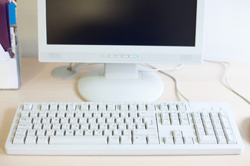 keyboard and flat computer screen