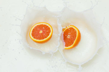 Orange and splashing milk