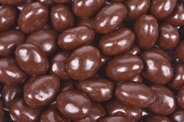 Dark brown dragee, chocolate covered nuts
