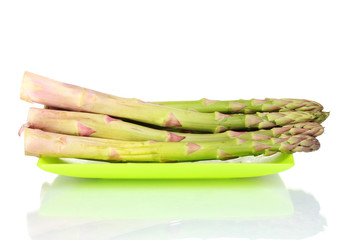 delicious fresh asparagus on a plate isolated on white