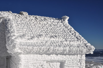 An ice-covered meteorological station, high on a mountain-top