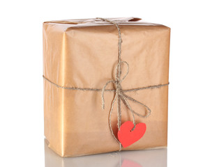 Parcel with blank heart-shaped label isolated on white