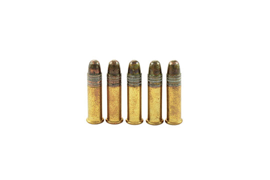 Five rounds of .22 caliber ammunition, isolated on white