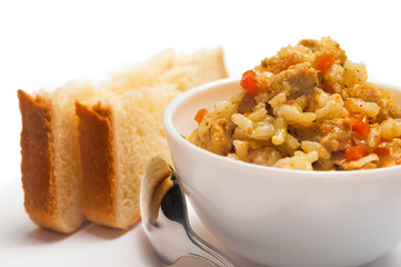 Pilaf with meat, carrots and two slices of bread