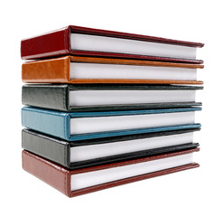 Stack of colorful leather note books