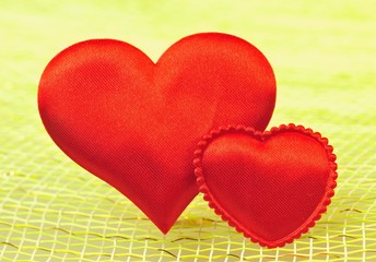 Two silk red hearts