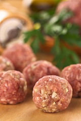 Raw meatballs with garlic (Selective Focus, Focus on the front)
