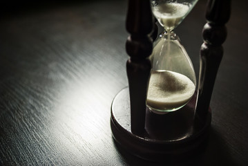 hourglass in a dark wood