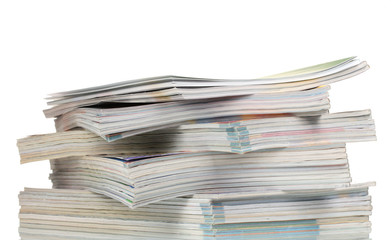 stacks of magazines isolated on white