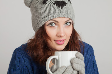 girl in blue with a mug