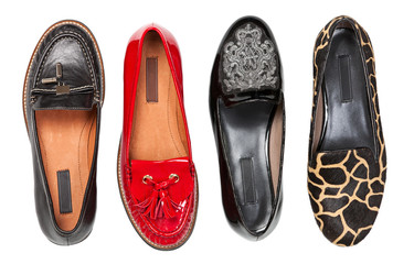 Four different female shoes over white, view from above