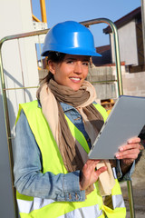 Architect on building site using electronic tablet