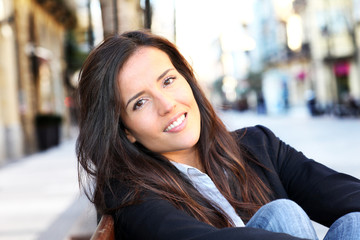 Portrait of beautiful smiling woman in town