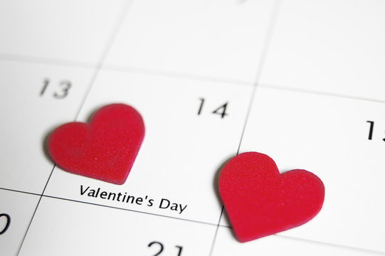 closeup of a valentine calendar with red hearts