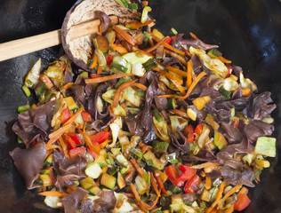 Mixing vegetable in wok